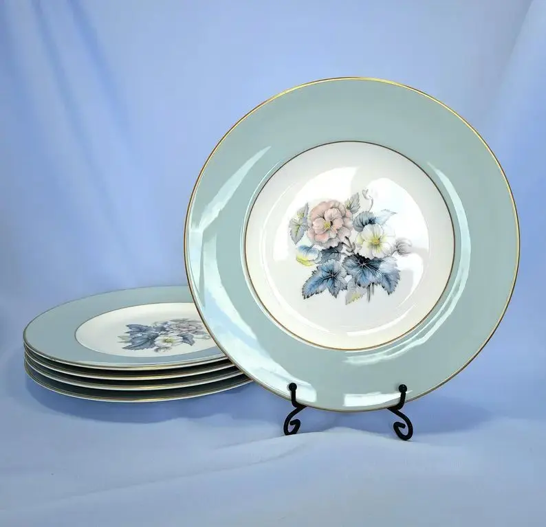 Royal Worcester Woodland salad plates with pale-blue borders, floral centres and gold trim.
