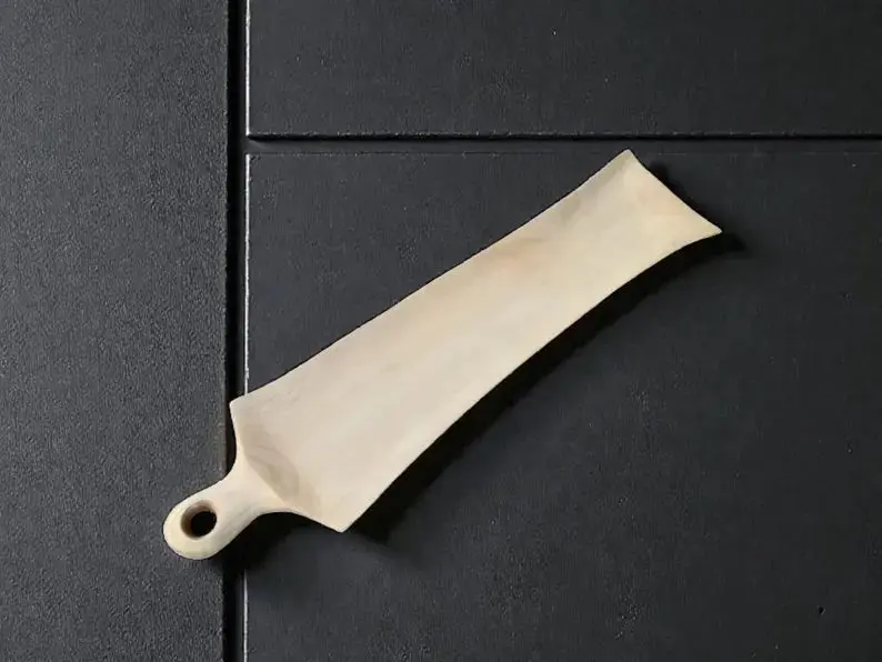 Long handmade walnut and maple bread serving board.