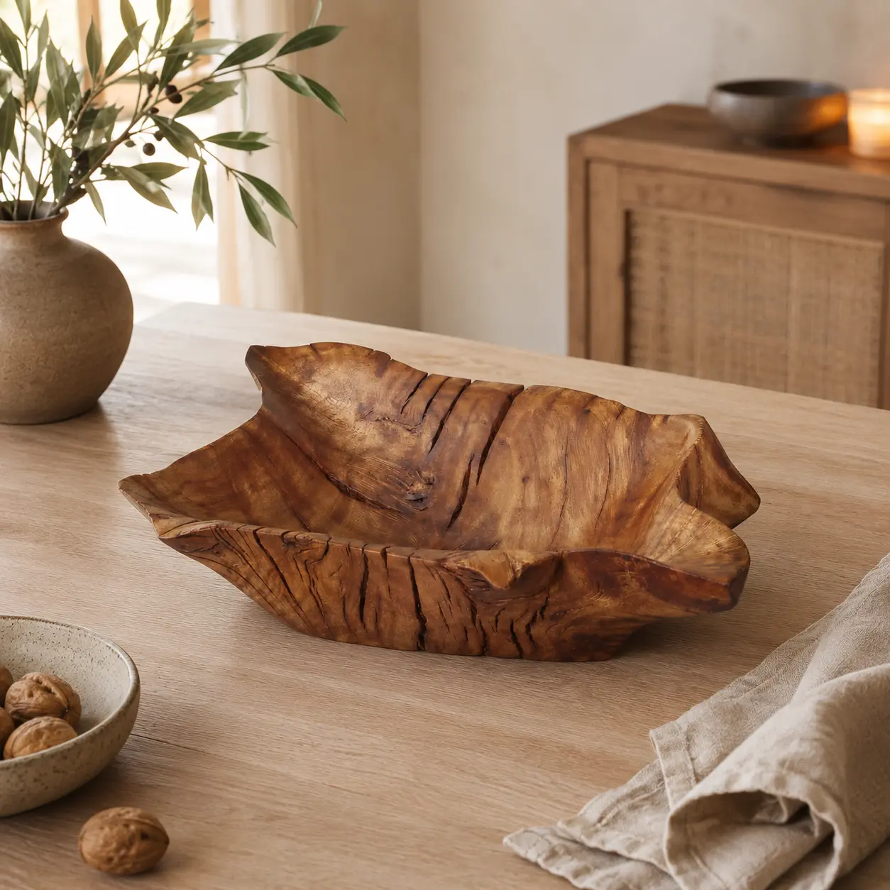 Handmade spalted apple wood bowl with an integrated bud vase in a warm interior setting.